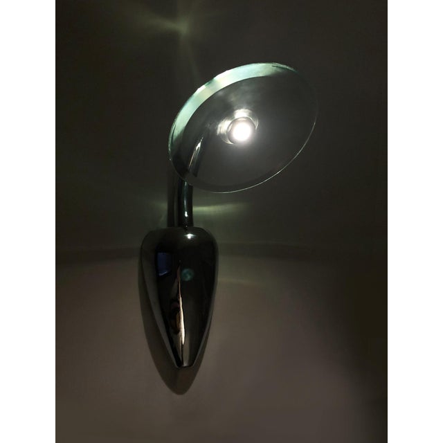 Pair of spanish-style designer wall lights in chrome-plated metal and glass chrome-plated metal frame. The wall lights are...