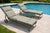 An exceptional pair of Russell Woodard wrought iron chaise lounges featuring the iconic sculpted mesh design and floral...