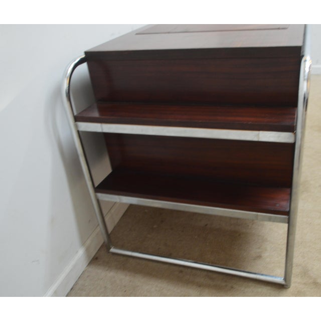 Writing Desk by Ralph Lauren. Store item #574. It features metal frame and leather top.