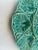 Imported from France. Classic teal green majolica oyster platter. Spaces for serving 12 oysters and two sauces. Shells...