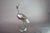Vintage crane bird sculpture from the 1960s, in the Art Deco style. The silver-toned metal bird stands on one leg on a...