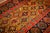 This antique Caucasian rug is a 3' 5" x 13' 7" runner featuring a striking yellow ground and bold, hand-knotted geometric...