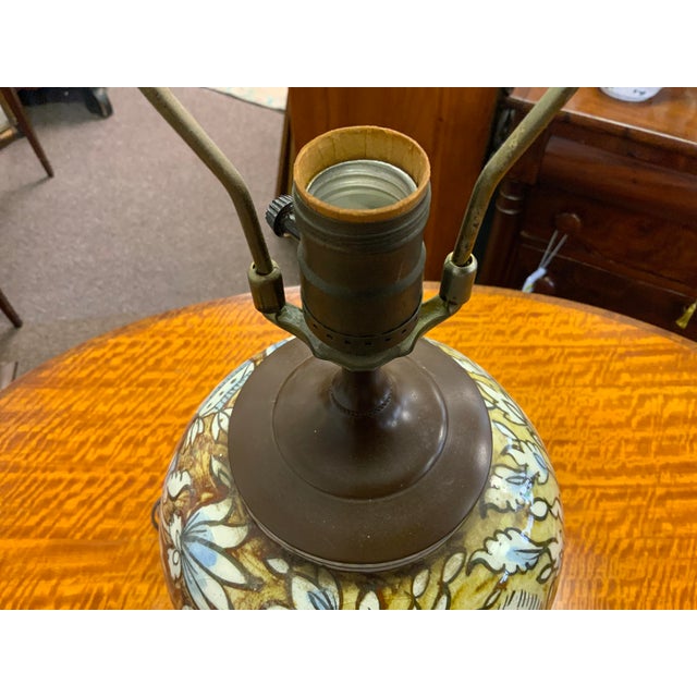 20th ceramic lamp. Possibly South or West Asian in design. Lovely bird and fish motif in blues and browns. Base to top of...