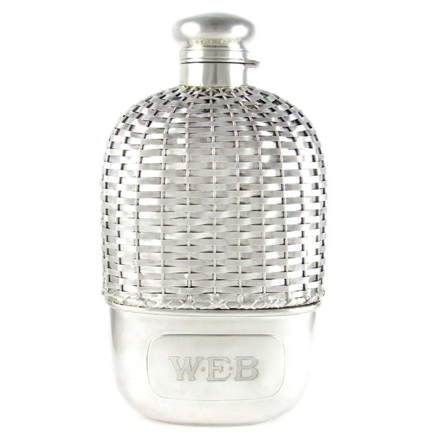 Elegant antique American sterling silver whiskey hip flask with woven motif by Gorham, c. 1907. Featuring intricate...