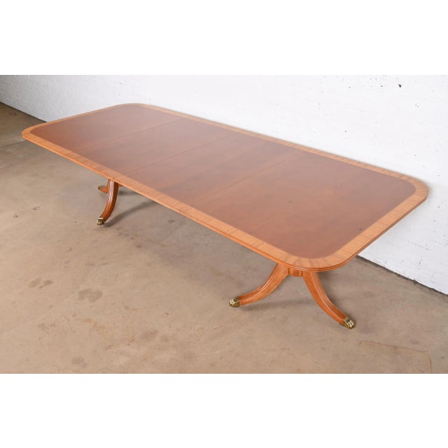 An exceptional Georgian or Regency style extension double pedestal dining table By Henredon USA, Circa 1980s Gorgeous...