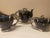 Vintage black and gold hand fired demitasse set. Set includes coffee pot with lid, sugar bowl with lid, creamer, 5 cups...