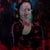 This oil on wood panel artwork presents a figure enveloped in a rich, dark background, evoking a sense of introspection...