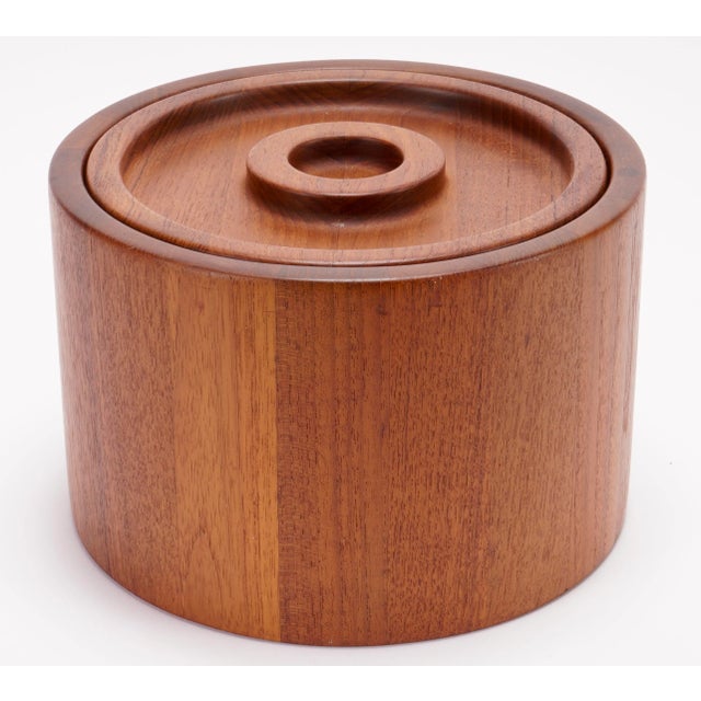 Beautiful Scandinavian staved teak lidded ice bucket designed by Jens Quistgaard for Dansk. Features a cylinder band with...