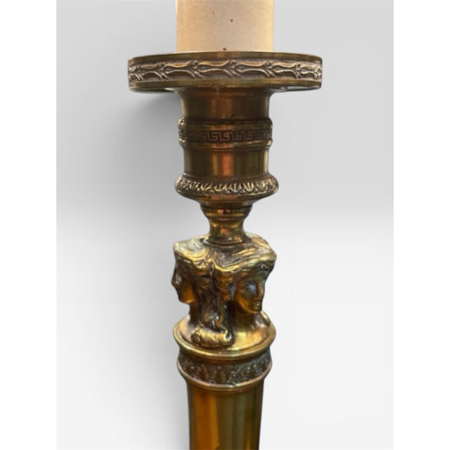 French Empire style bouillotte lamp features a polished brass body and brass arrow finial with white metal shade. Stunning...