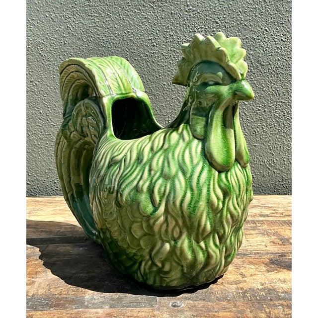Invite a touch of rustic French elegance into your home with this striking pair of vintage rooster cache pots. Masterfully...