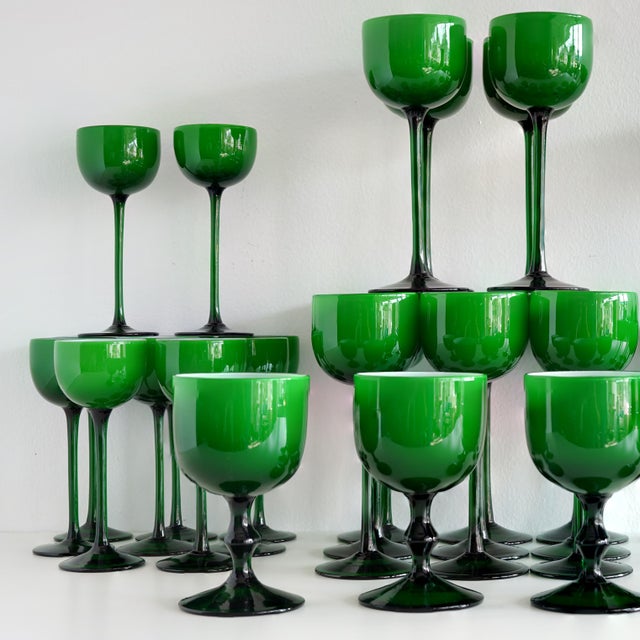 Vintage circa 1970s Carlo Moretti Italian drinking glasses in emerald green cased with white glass interiors. A set of 36...