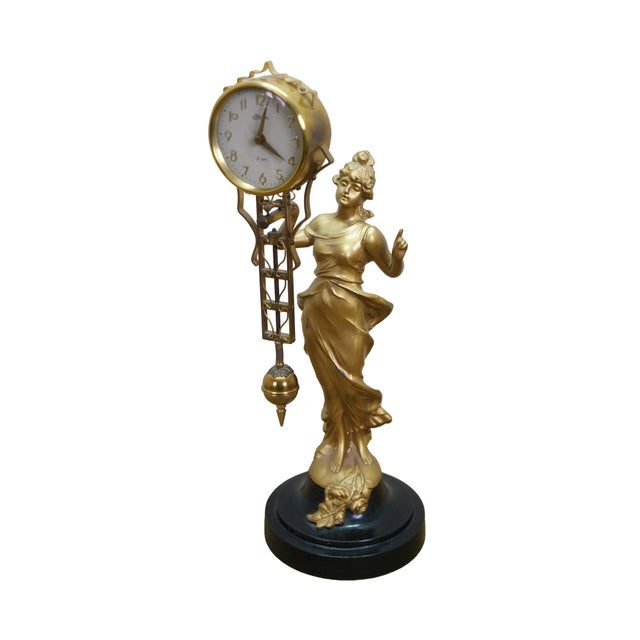 Mid century Japanese Linden 8 day figural Diana swinging clock statue. It features an Art Deco / Nouveau Diana statue...