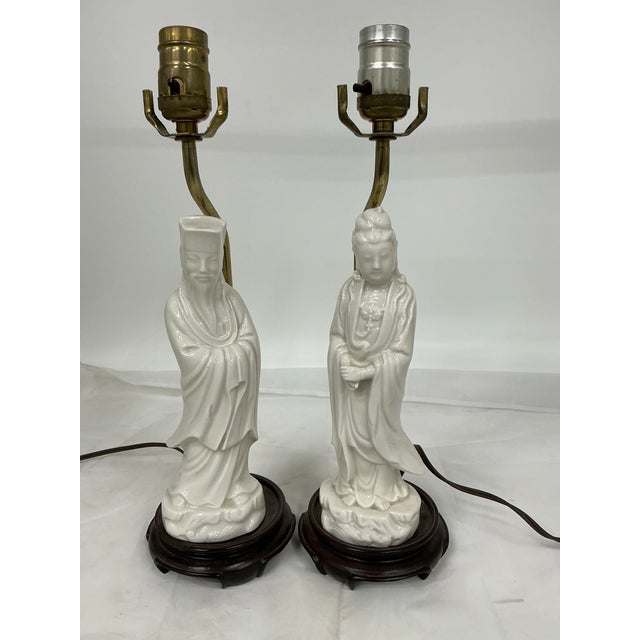 Nice pair on petite porcelain Asian style figural lamps. Lamp shades ore not perfect, but can be included free of charge .