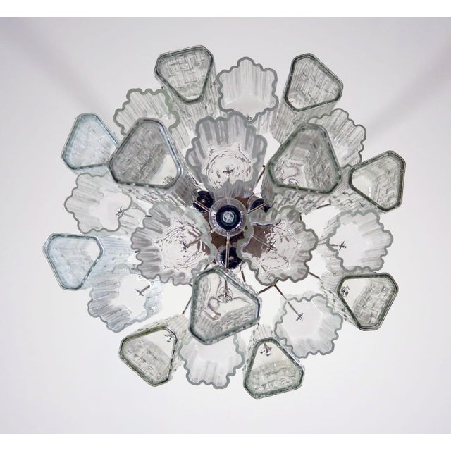 Italian chandelier made of 22 individual tubular glass pendants hanging on a chrome frame. Produced in Italy Glass and...