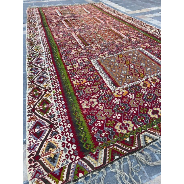 An extraordinary and exceptionally rare vintage flat-weave kilim, lovingly preserved in a chest for decades, maintaining...