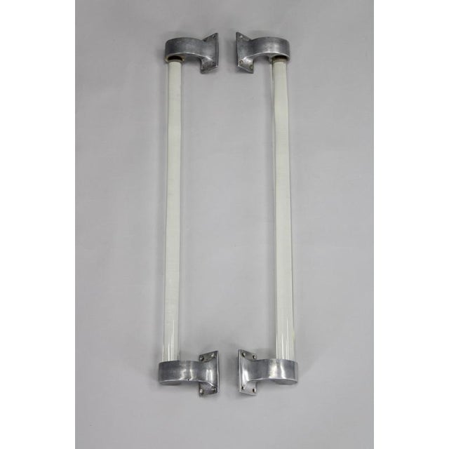 A matched pair of 1930s Art Deco handles originating from Czechoslovakia. Each piece features a long clear glass tube...