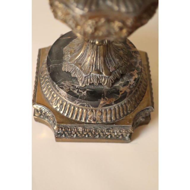 Enhance your interior with this striking pair of vintage table lamps, showcasing an exquisite and dramatic design....