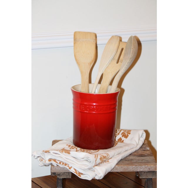 A vintage utensil crock by Le Creuset, #0905 with the band at the top, part of its "classical" collection. No chips or...