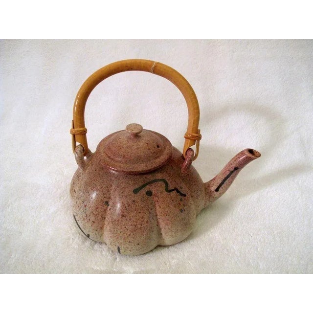 Lobed teapot with red speckled glaze by Michael Pratt, Portland Oregon Measure 8" X 9 1/2" Excellent condition, no chips,...