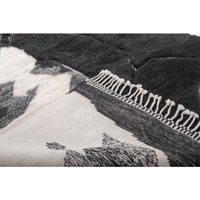 Bold, expressive, and impossible to ignore. This artistic hand-knotted Moroccan rug is a statement in contemporary...