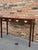 Nothing is quite as English as a mahogany side table with George III brass hardware pulls! The 4 drawers still glide...