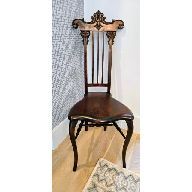 Add a touch of grandeur to your décor with this stunning Antique Victorian High-Back Side Chair. Featuring an elaborate,...