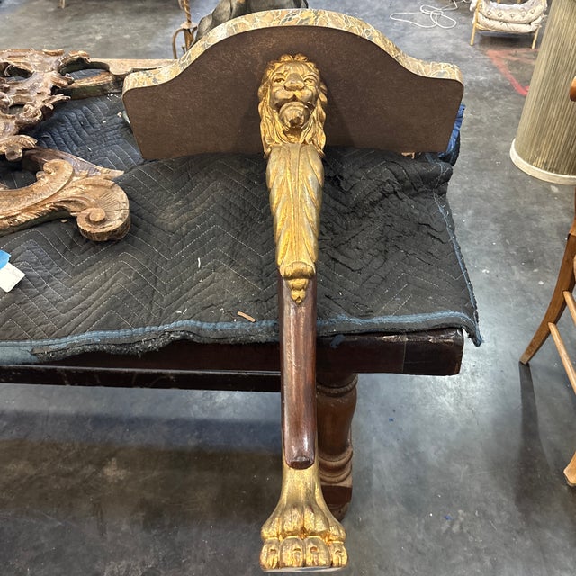 A fabulous decorative wall bracket with faux marble top and single wood leg with a hand carved profile of a lion at top...
