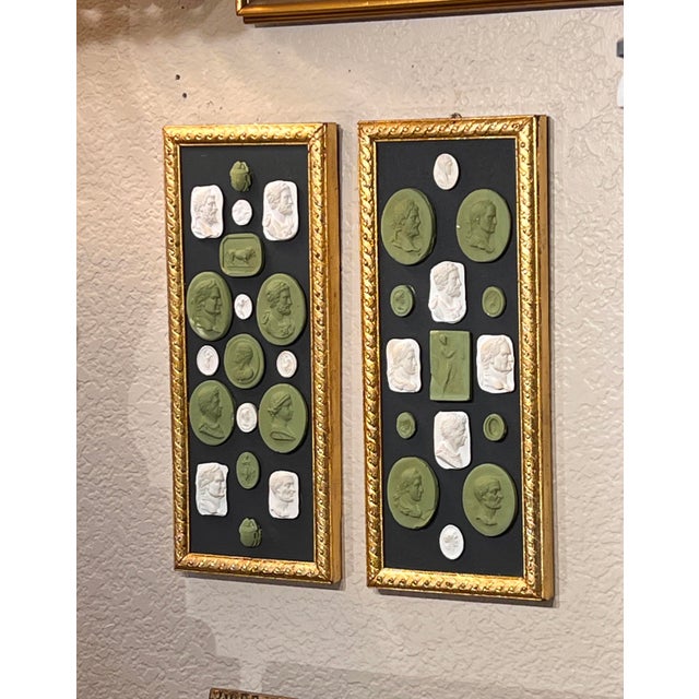 A beautiful pair of Grand Tour revival small panels displaying white and wedgwood green painted profile cameo and intaglio...