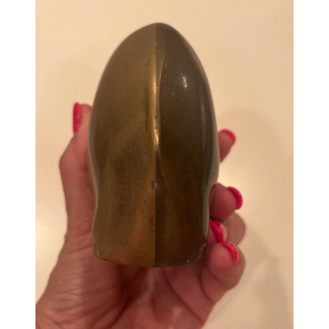 This vintage brass elephant piggy bank was made in Korea approximately 1960’s. It features a slot at the top to insert...