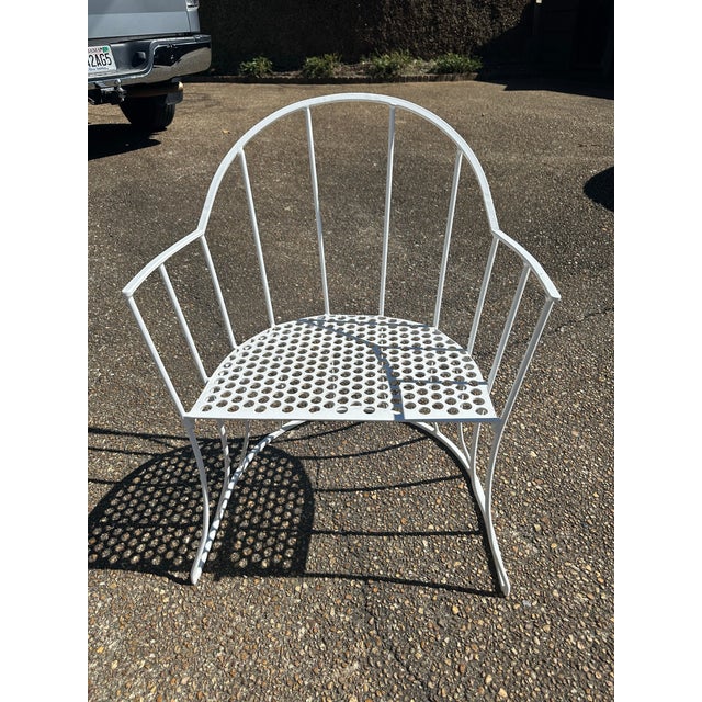 MCM charmers! This set of four white metal chairs are freshly powder-coated, ready to shine on your patio, terrace,...