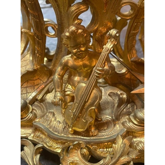 The 19th c. French Louis XV Bronze Dore’ Mantle Clock is a stunning decorative collectible piece that adds elegance and...