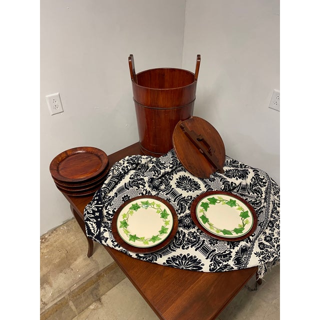 Add rustic charm to your home with this striking circa 1930 Japanese lidded storage bucket, accompanied by 10 shallow...