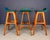 This elegant trio of mid-century bar stools, designed by Danish furniture maker Erik Buch, showcases the sculptural...