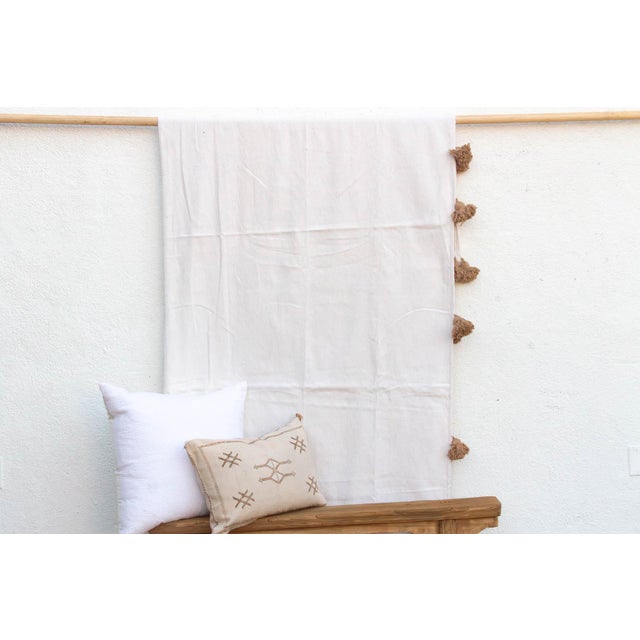 This piece is a study in texture over color. Inspired by the snow-capped Atlas Mountains and the raw earth of the...