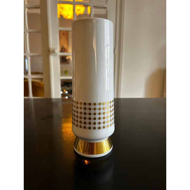 White porcelain vase with gold decoration from the 1960s/70s. Produced by Winterling. This piece has an attribution mark,...