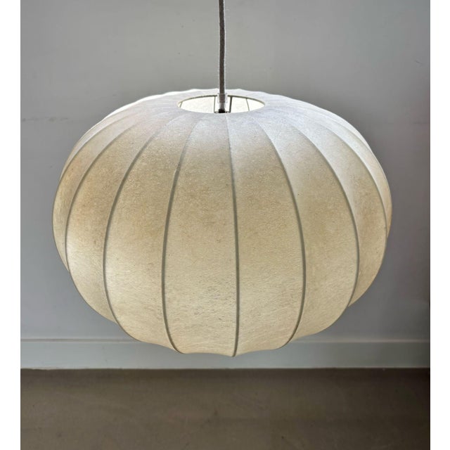 Mid-Century Modern Cocoon pendant lamp by Goldkant Leuchten, designed by Friedel Wauer in the 1960s. These lamps, known as...