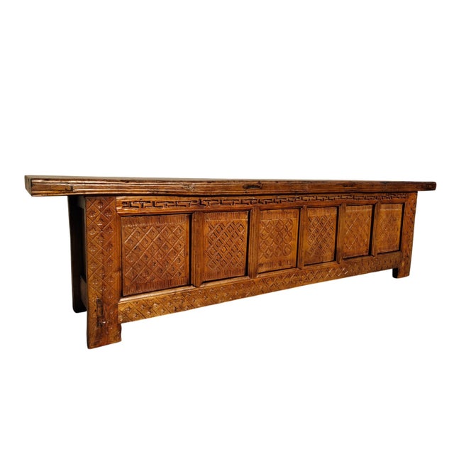This low 19th century sideboard is made from solid poplar wood with a warm, weathered golden-brown finish. The low-profile...