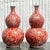 A pair of fabulous vintage Asian vases. This pair of Asian vases are in a beautiful shade of red with amazing details of...