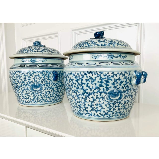 Pair of Blue & White Porcelain Chinese Rice Pots. Each with tapering form and floral and scrolling vine decoration....