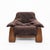 Brutalist armchair in solid oak with a padded cushion upholstered in chocolate brown Alcantara, 1970s. A piece that...