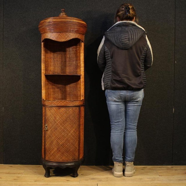 Oriental furniture from the second half of the 20th century. A single-piece, non-detachable woven wood and rattan column,...