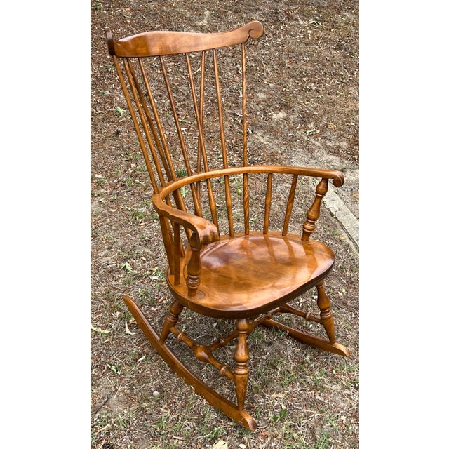 Classic New England style in this fan back Windsor rocking chair from Nichols & Stone of Gardner Mass. Carved crest, well...