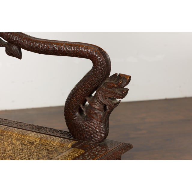 English Anglo-Indian 1900 Armchair with Carved Back, Mythical Creatures and Woven Rattan For Sale - Image 3 of 12