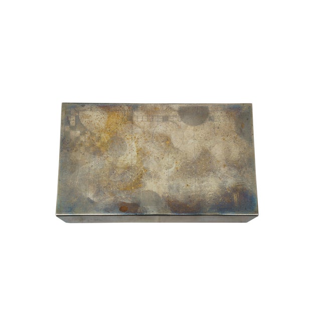 Mid to early 20th century mahogany metal cigarette / snuff / trinket box. Rectangular silver plate body etched with an art...