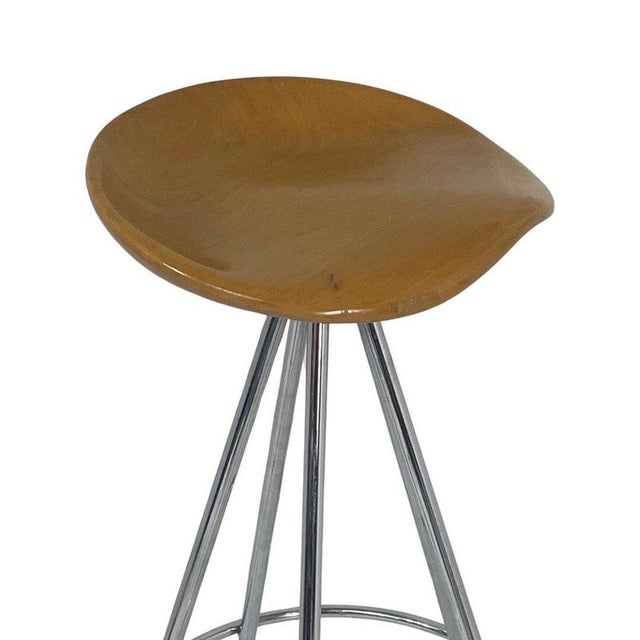Designed by Pepe Cortes and made in Spain by Amat-3 for Knoll. A wooden saddle-like seat rests sturdy on five tubular...