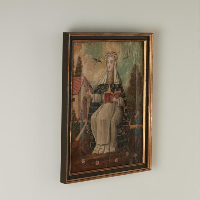 Magical 18th century religious oil painting on canvas of a female saint or nun with birds in a garden setting. Presented...