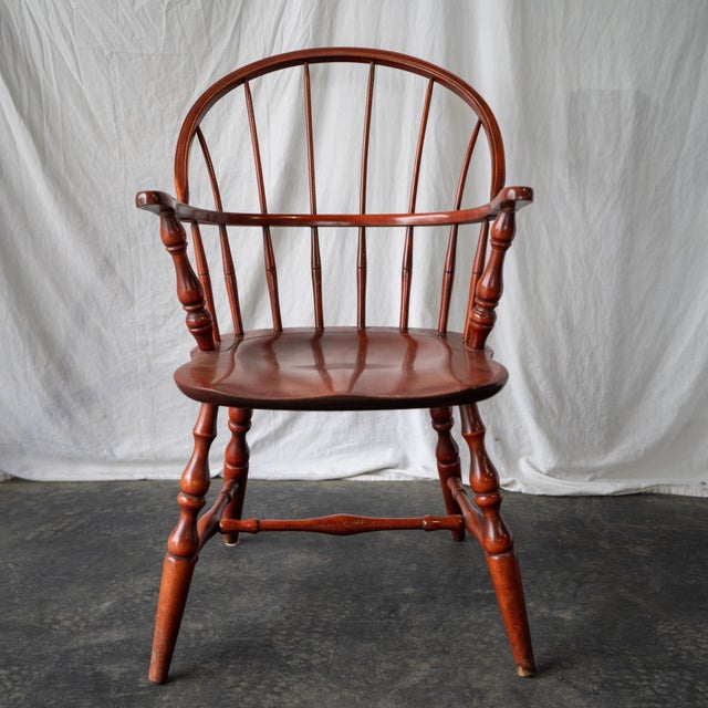Pair of mid-century captain's chairs in Windsor style. Unusually attractive proportions and curvature, plus slim spindles,...