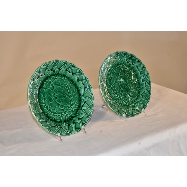 Pair of 19th century majolica leaf plates in rich green glaze. the border of the plates is a basketweave pattern, with the...