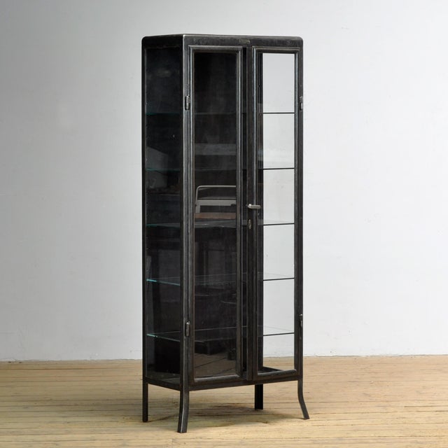 Medicine cabinet from the 1910s, produced by Santo B. Semoff in Sofia, Bulgaria. This cabinet is made of iron and glass,...