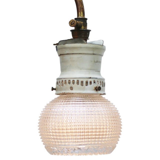 Sconce wall lamp / rewired gas lamp. Ca 1900 White enamel top with clear pressed Holophane glass shade Brass arm diameter...